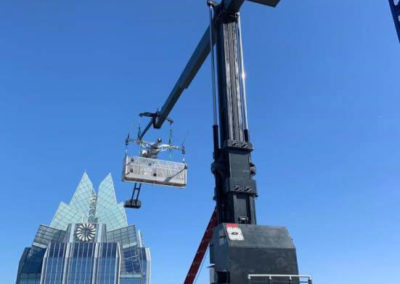 GPIT on Colorado St in Texas on a sunny day with a high rise in the background-US