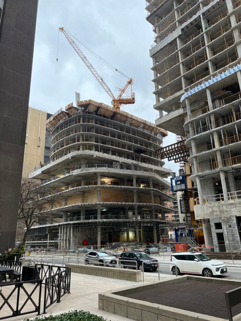 Outside shot of 234 Simcoe, Artists' alley, with 3 dual construction elevators